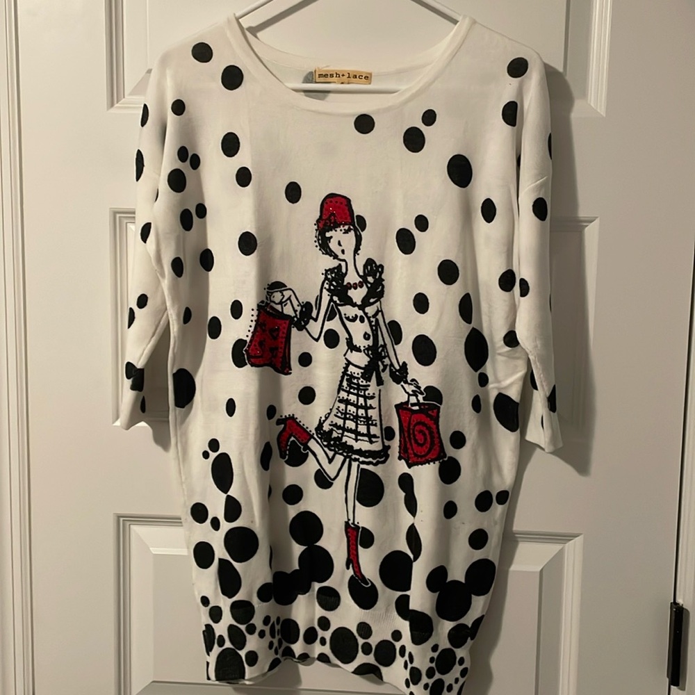 Light weight 3/4 sleeves fun sweater. Jewels on front of sweater not on the back
